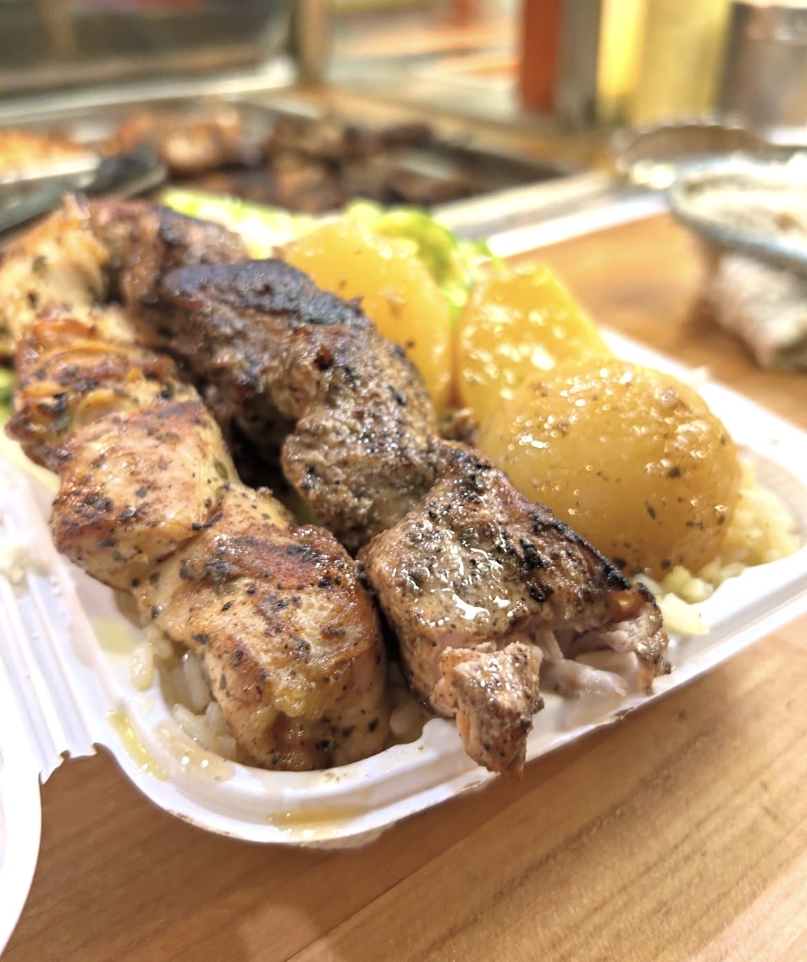 Chicken and pork souvlaki dinner with lemon potatoes